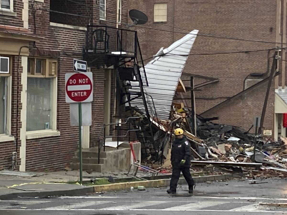 Emergency personnel work at the site of a deadly explosion at a chocolate factory in West Readi ...