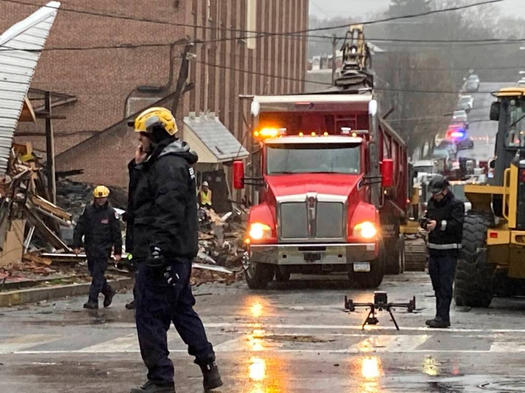 Emergency personnel work at the site of a deadly explosion at a chocolate factory in West Readi ...