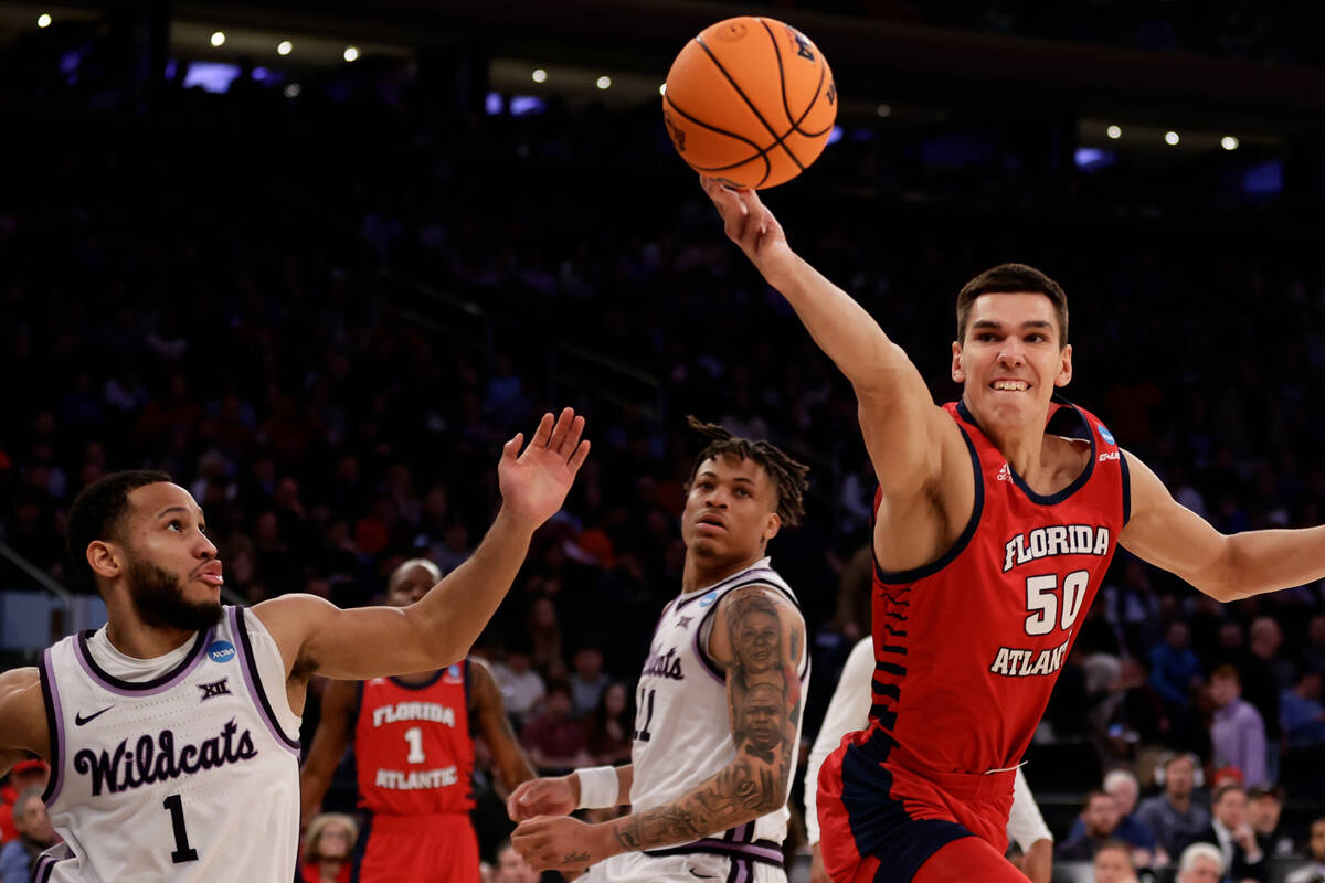 Florida Atlantic's Vladislav Goldin (50) battles for a rebound in the second half of an Elite 8 ...