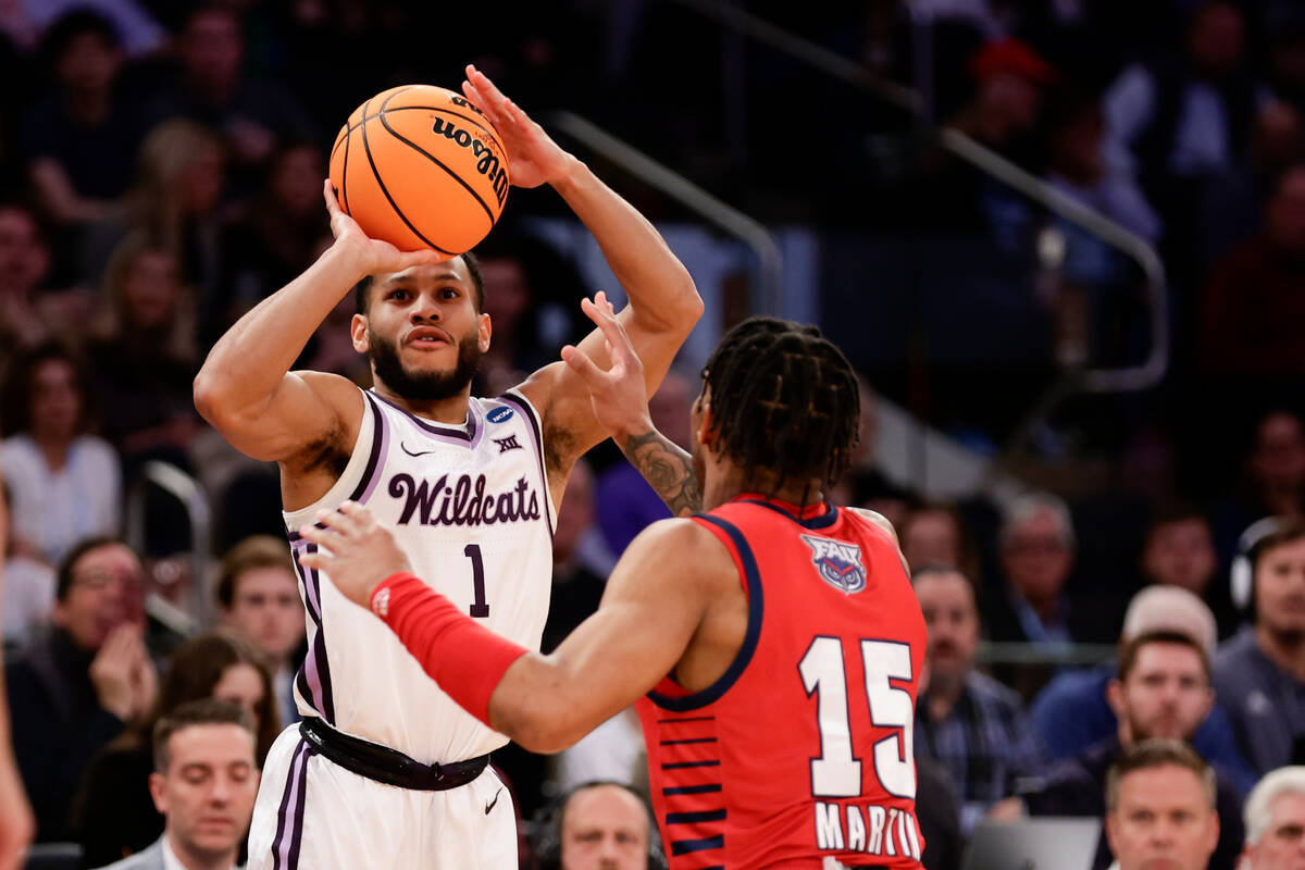 Kansas State's Markquis Nowell (1) looks to shoot against Florida Atlantic's Alijah Martin (15) ...