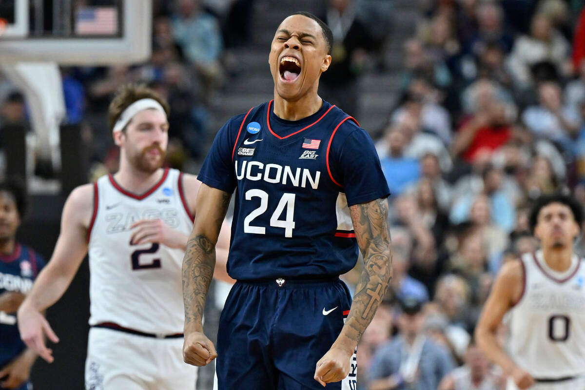 UConn guard Jordan Hawkins (24) celebrates in the second half of an Elite 8 college basketball ...