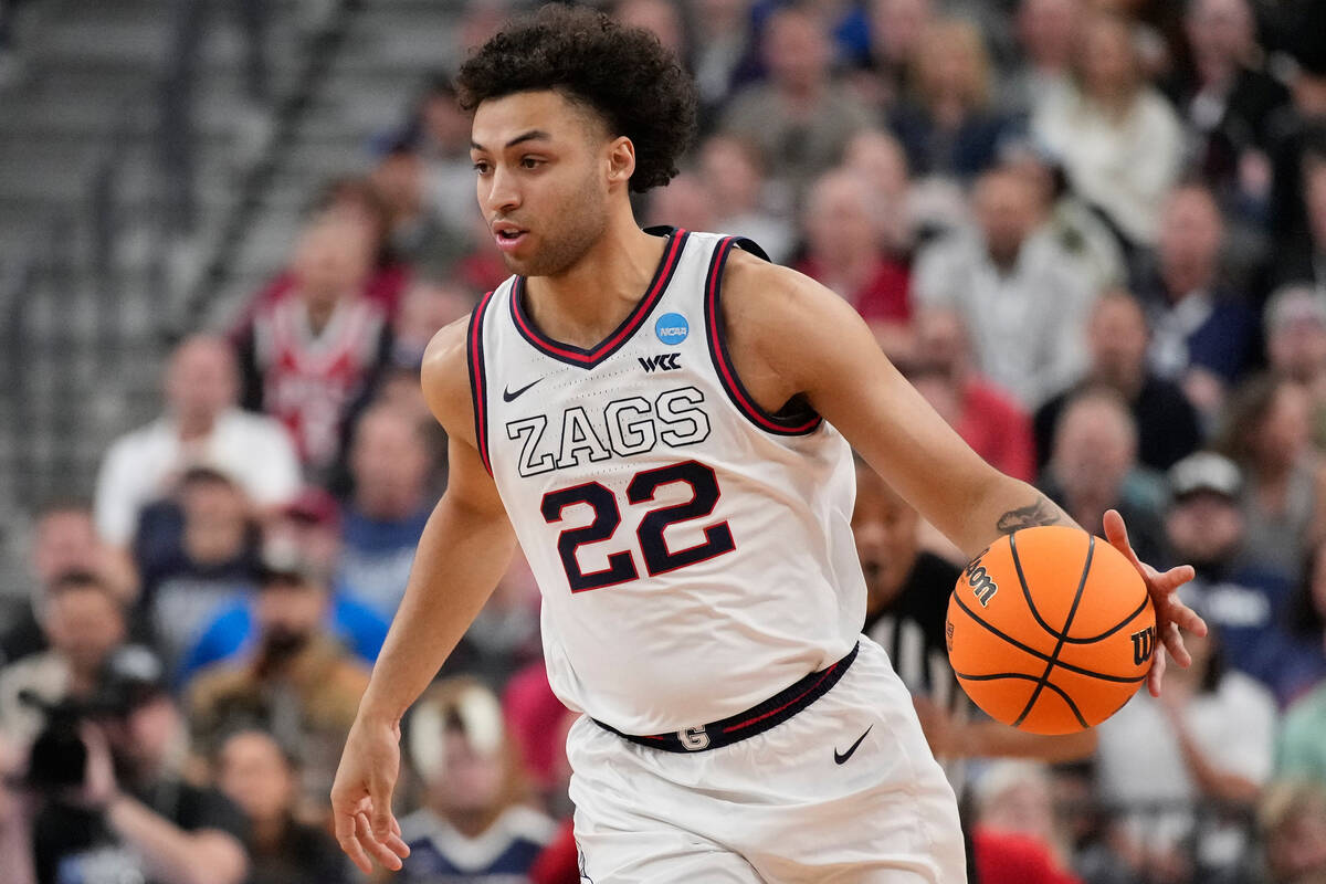 Gonzaga forward Anton Watson (22) dribbles down the court in the first half of an Elite 8 colle ...