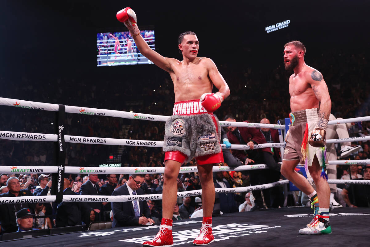 David Benavidez, left, raises his arm at the end of the interim WBC world super middleweight ti ...