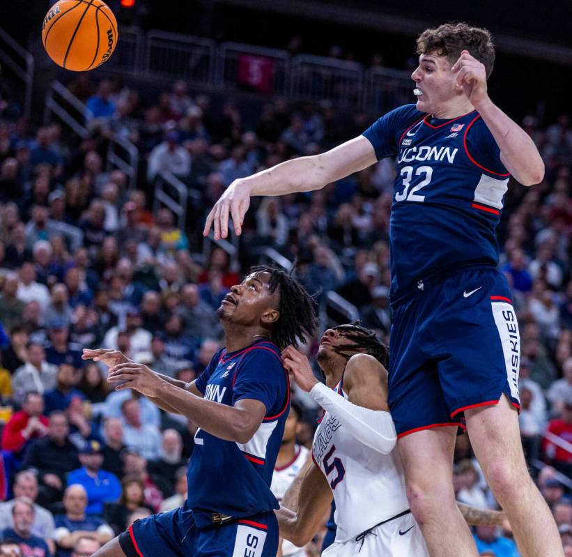 UConn center Donovan Clingan (32) rejects a shot attempt by Gonzaga guard Hunter Sallis (5) wit ...