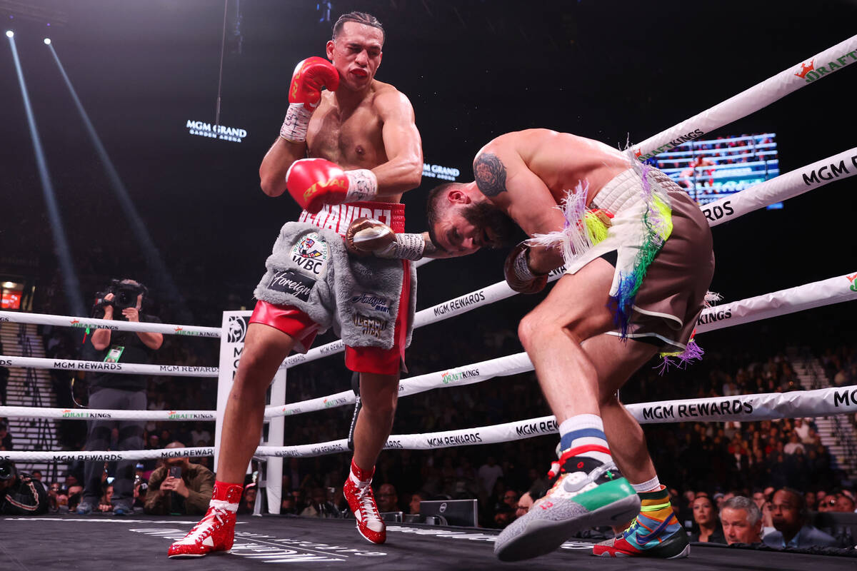 Caleb Plant, right, moves away from a punch from David Benavidez, in the interim WBC world supe ...