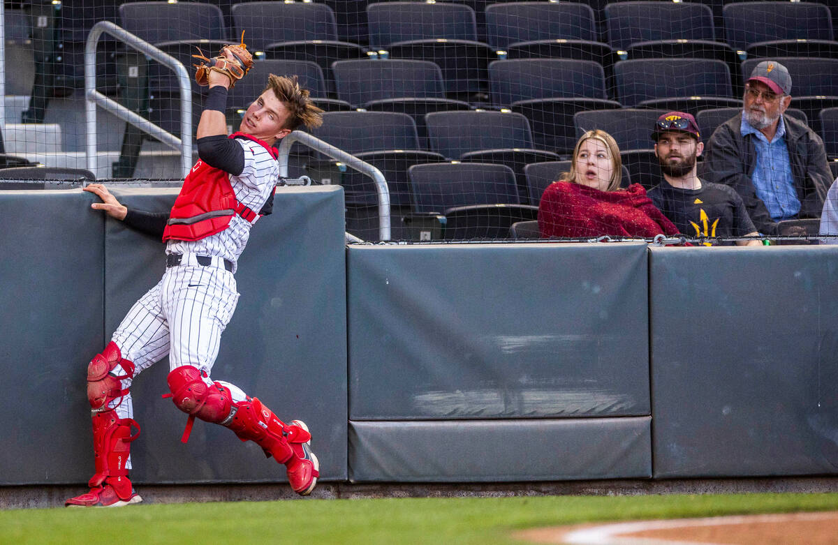 UNLV catcher Chase Gallegos (49) makes a grab against Arizona State during the third inning aga ...