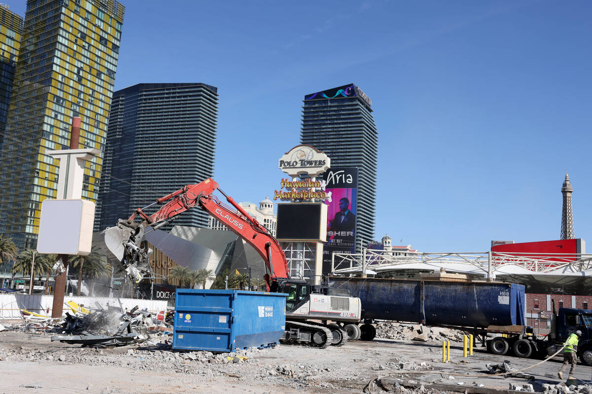 Crews clear the remains of buildings at 3755 Las Vegas Blvd. South on the Strip in Las Vegas Mo ...