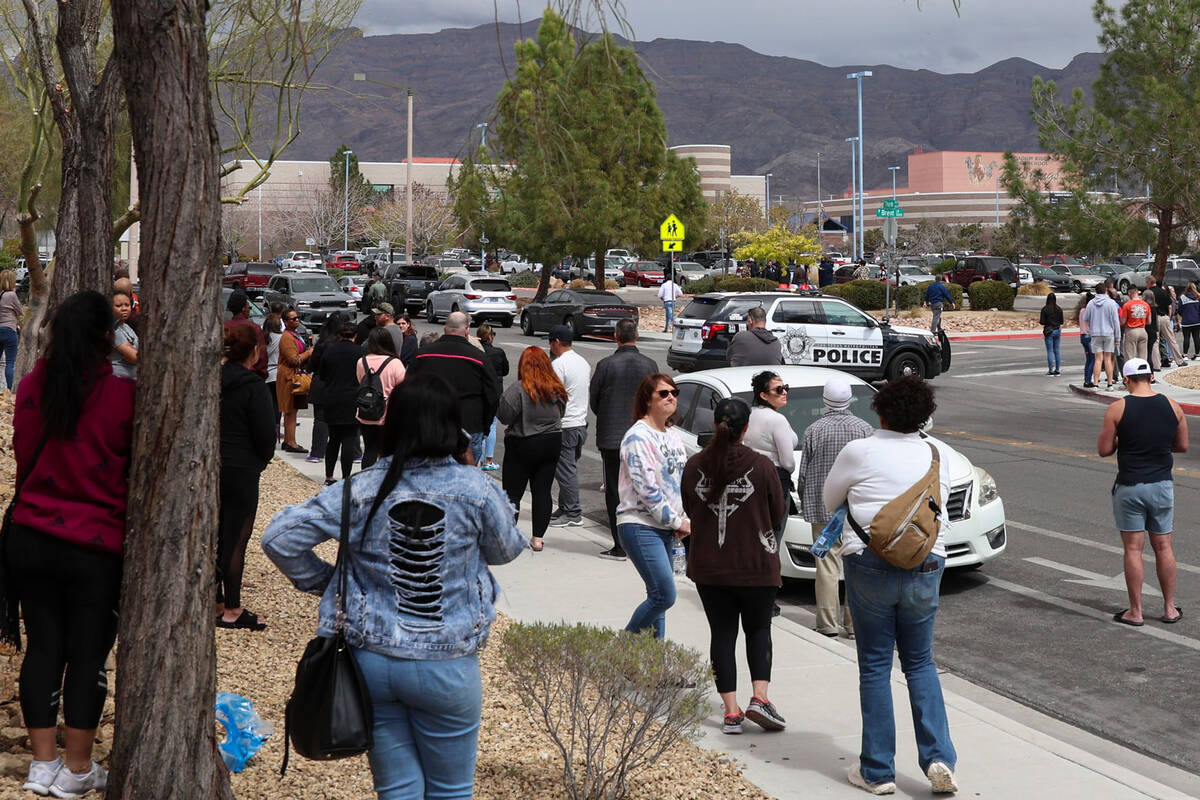 Parents wait outside of Shadow Ridge High School as Las Vegas police investigate after a threat ...