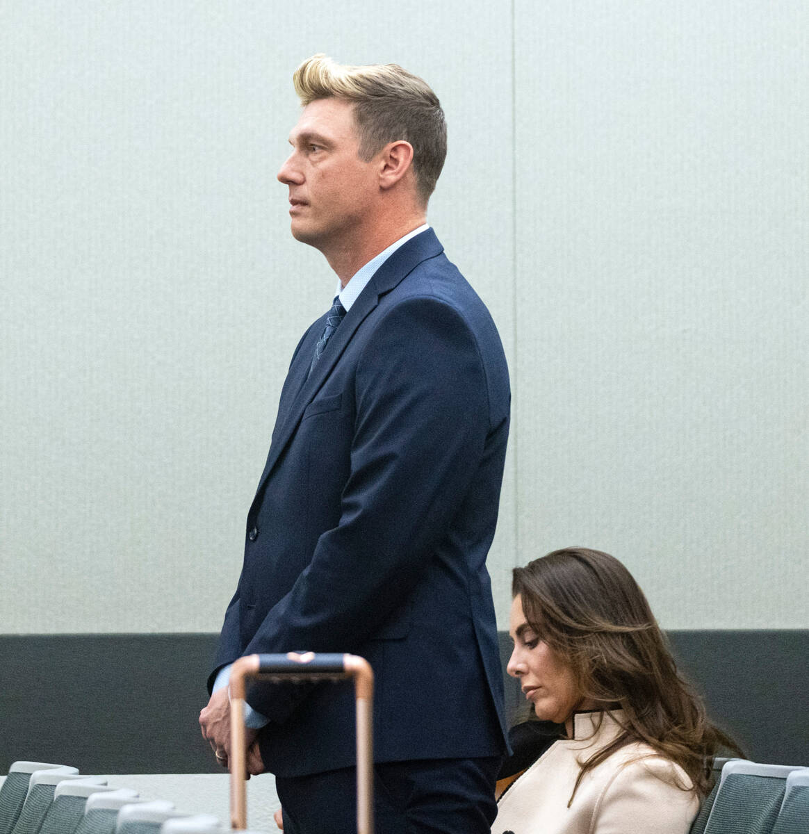 Nick Carter, a member of the Backstreet Boys, appears in court with his wife Lauren Kitt during ...