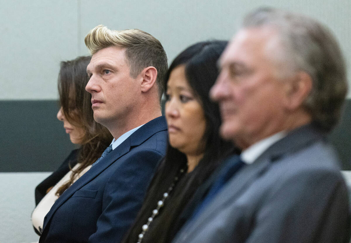 Nick Carter, second right, a member of the Backstreet Boys, appears in court with his wife Laur ...