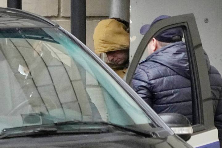 Wall Street Journal reporter Evan Gershkovich is escorted by officers from the Lefortovsky cour ...