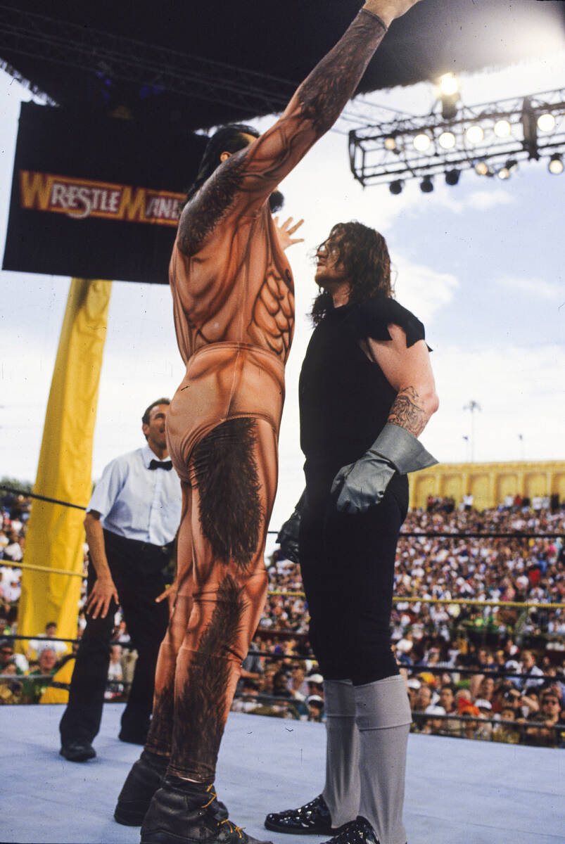 Mark Calaway looks up at Giant Gonzalez during what was arguably the worst match of his three-d ...