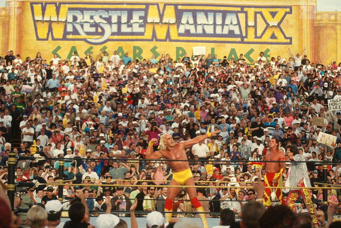 Hulk Hogan poses in the ring with Brutus "The Barber" Beefcake and Jimmy Hart. (WWE)