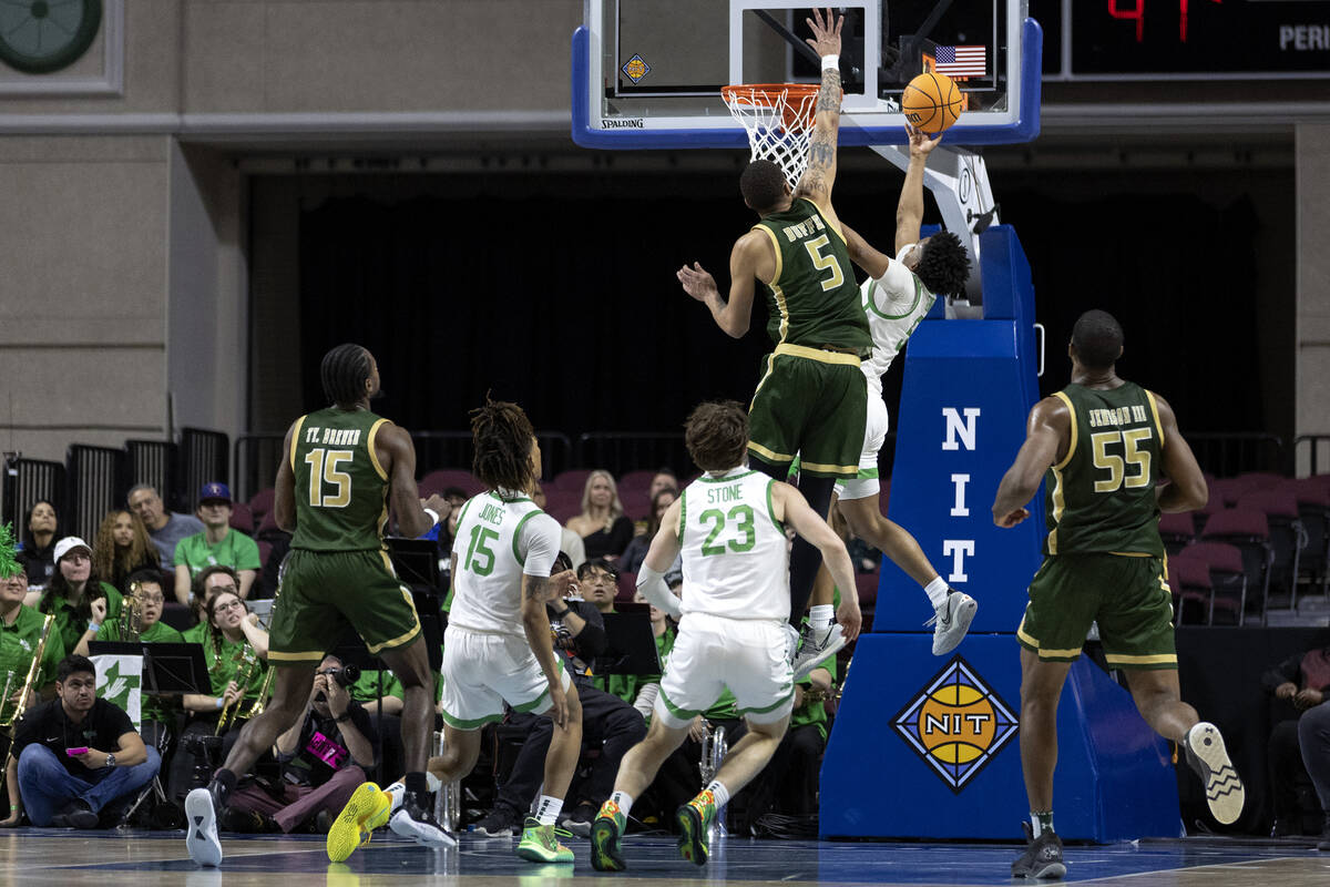 North Texas Mean Green guard Tylor Perry (5) shoots against UAB Blazers forward KJ Buffen (5) d ...