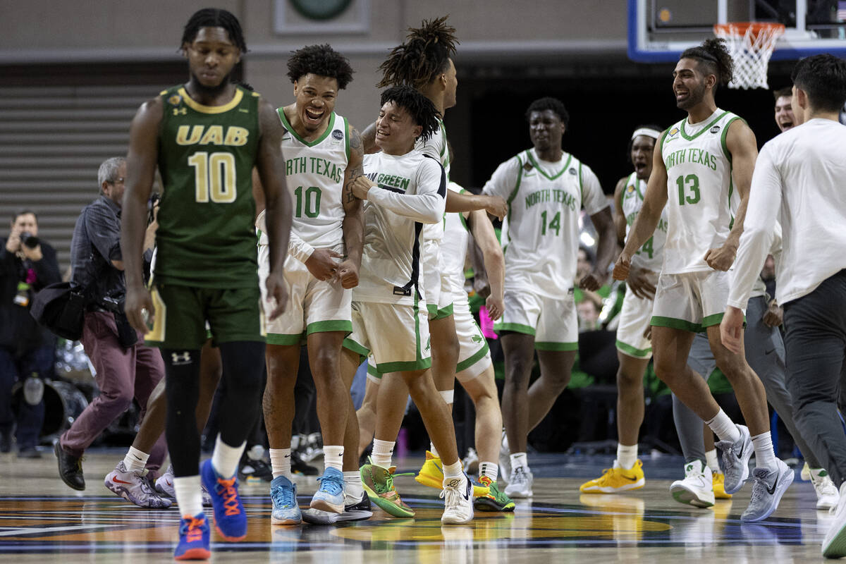 The North Texas Mean Green celebrate after winning the National Invitation Tournament champions ...