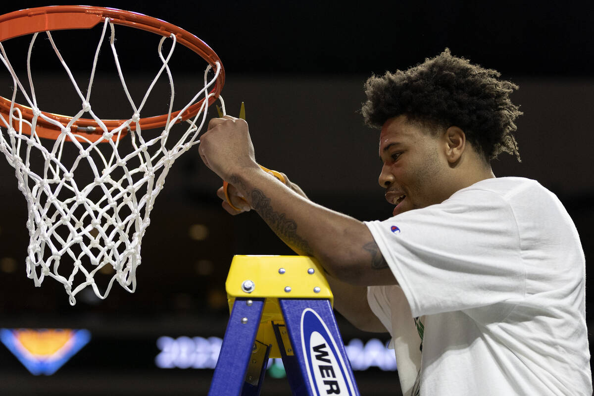 North Texas Mean Green guard Kai Huntsberry cuts the net after his team won the National Invita ...