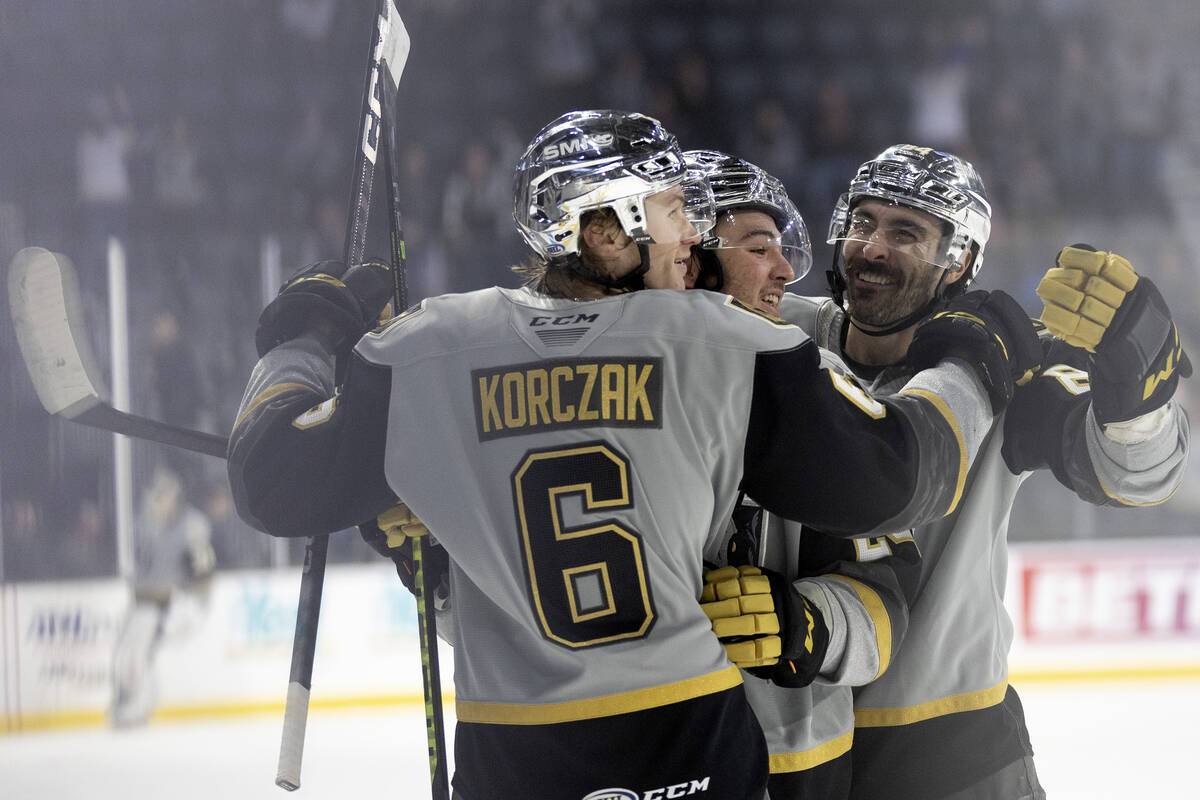 Henderson Silver Knights defenseman Kaedan Korczak (6), forward Brendan Brisson, center, and de ...