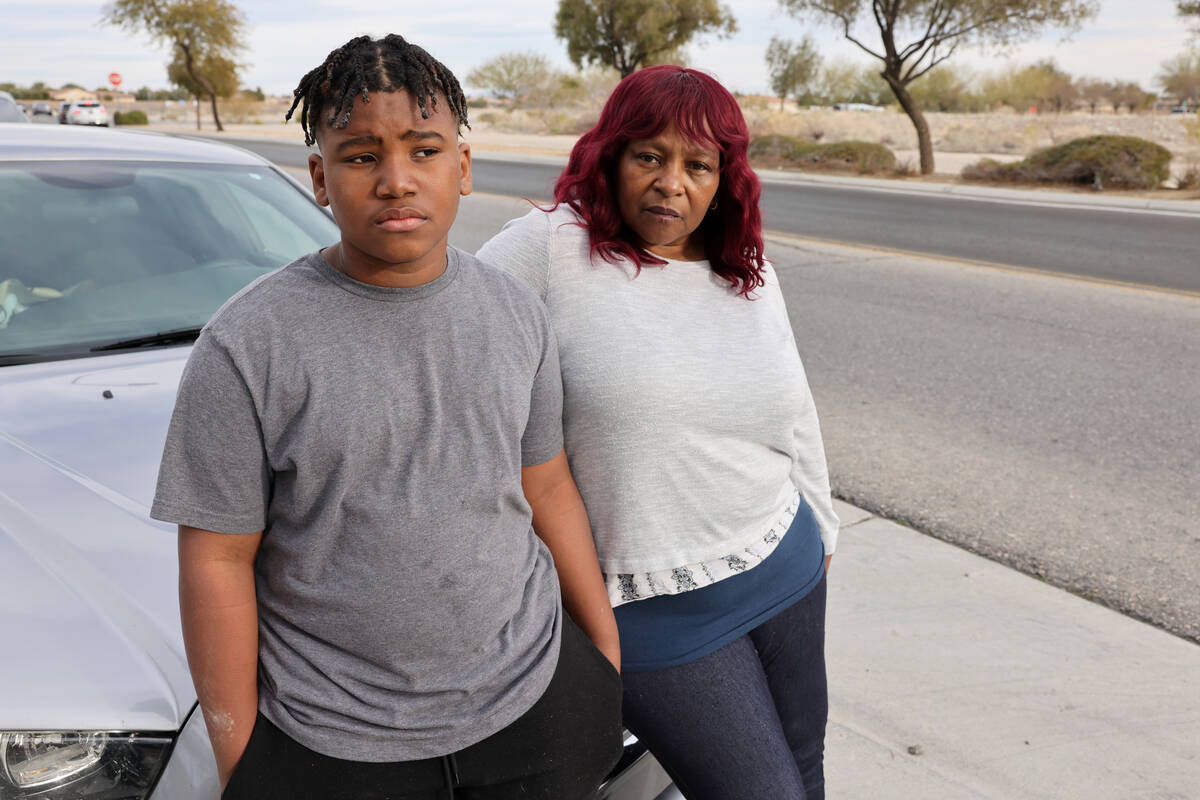 Peterson Academic Center sixth grader Adrian Quigley, 11, with his grandmother Cherri Mims at h ...