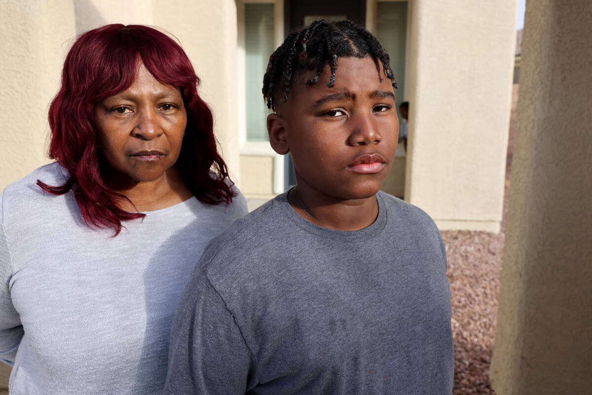 Peterson Academic Center sixth grader Adrian Quigley, 11, with his grandmother Cherri Mims at t ...