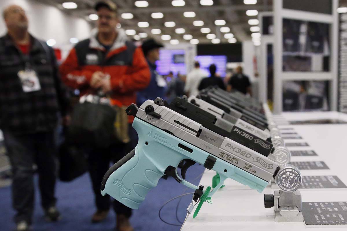 FILE - In this May 4, 2018, file photo, handguns are on display at the NRA convention in Dallas ...