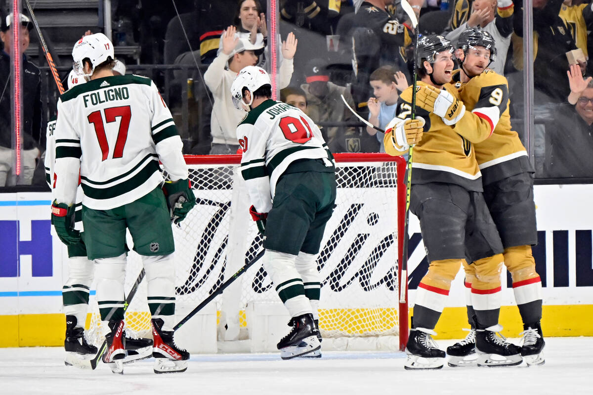 Vegas Golden Knights defenseman Ben Hutton (17) and center Jack Eichel (9) celebrate after a go ...