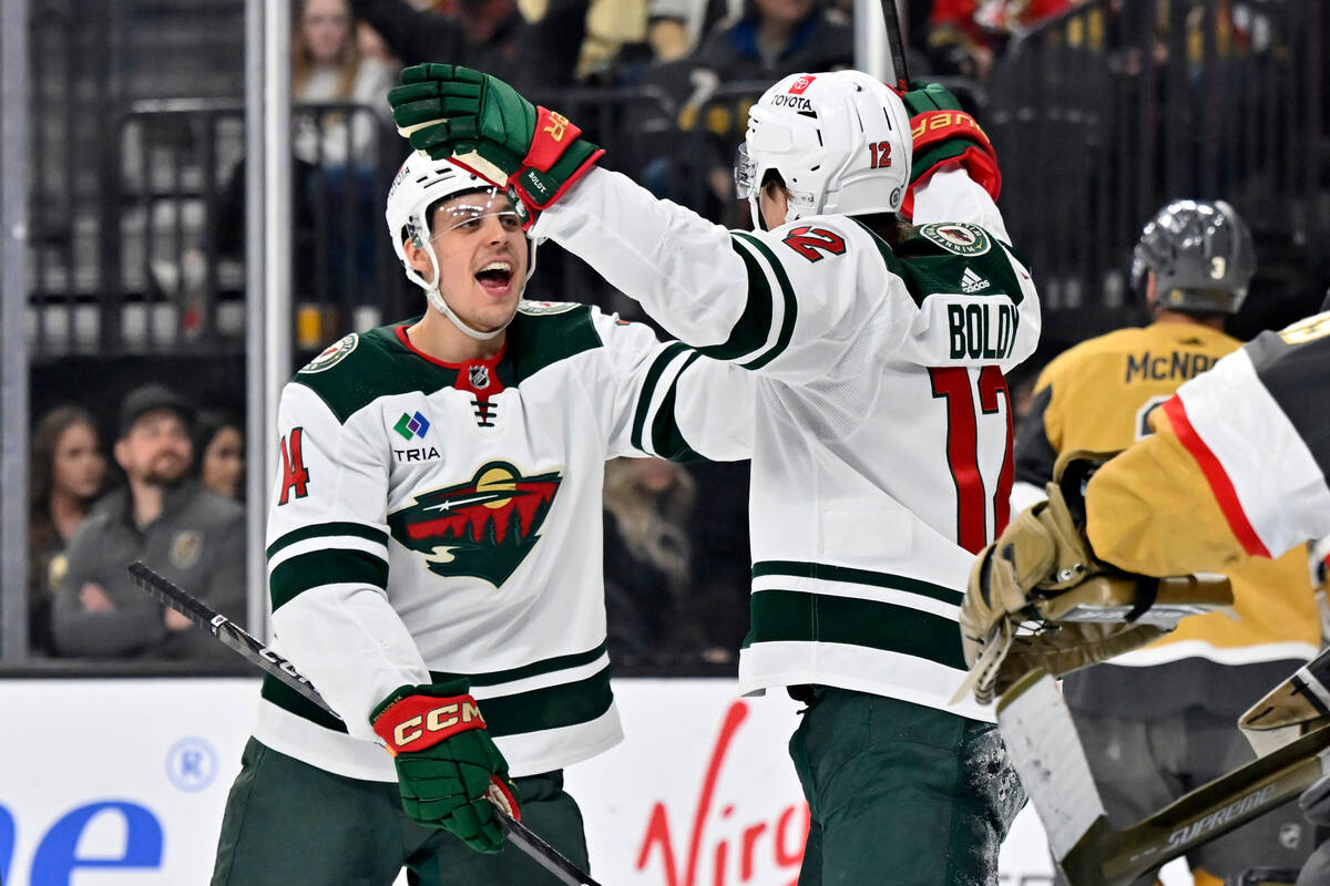 Minnesota Wild center Joel Eriksson Ek (14) and left wing Matt Boldy (12) reacts after a goal b ...