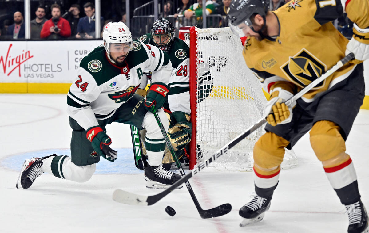 Minnesota Wild defenseman Matt Dumba (24) defends against Vegas Golden Knights center Nicolas R ...