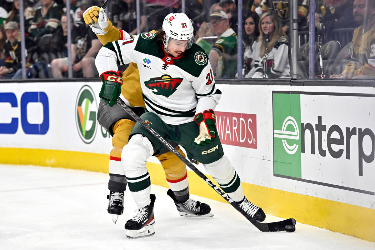 Minnesota Wild right wing Brandon Duhaime (21) skates with the puck against Vegas Golden Knight ...