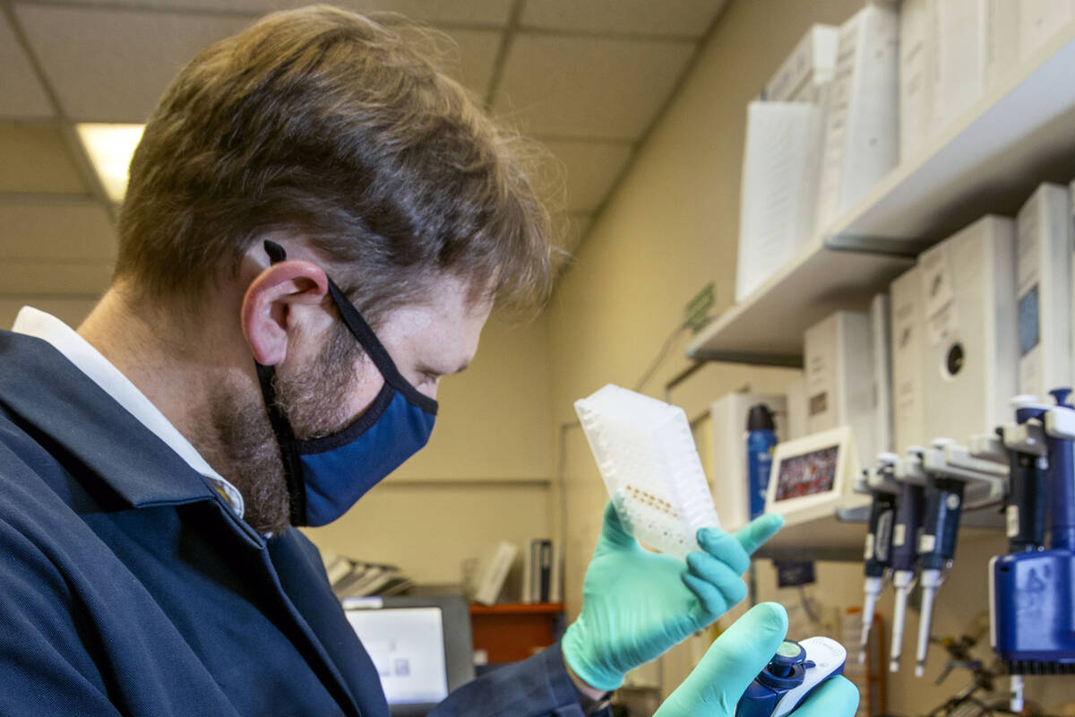 In this April 8, 2021, file photo, Dr. Andrew Gorzalski of the Nevada State Public Health Lab ...