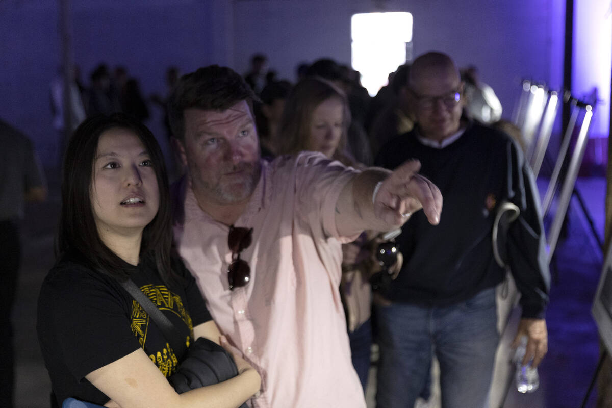 Alexia Chen and Brian Garth view the architecture exhibit in at the Huntridge Theater during an ...