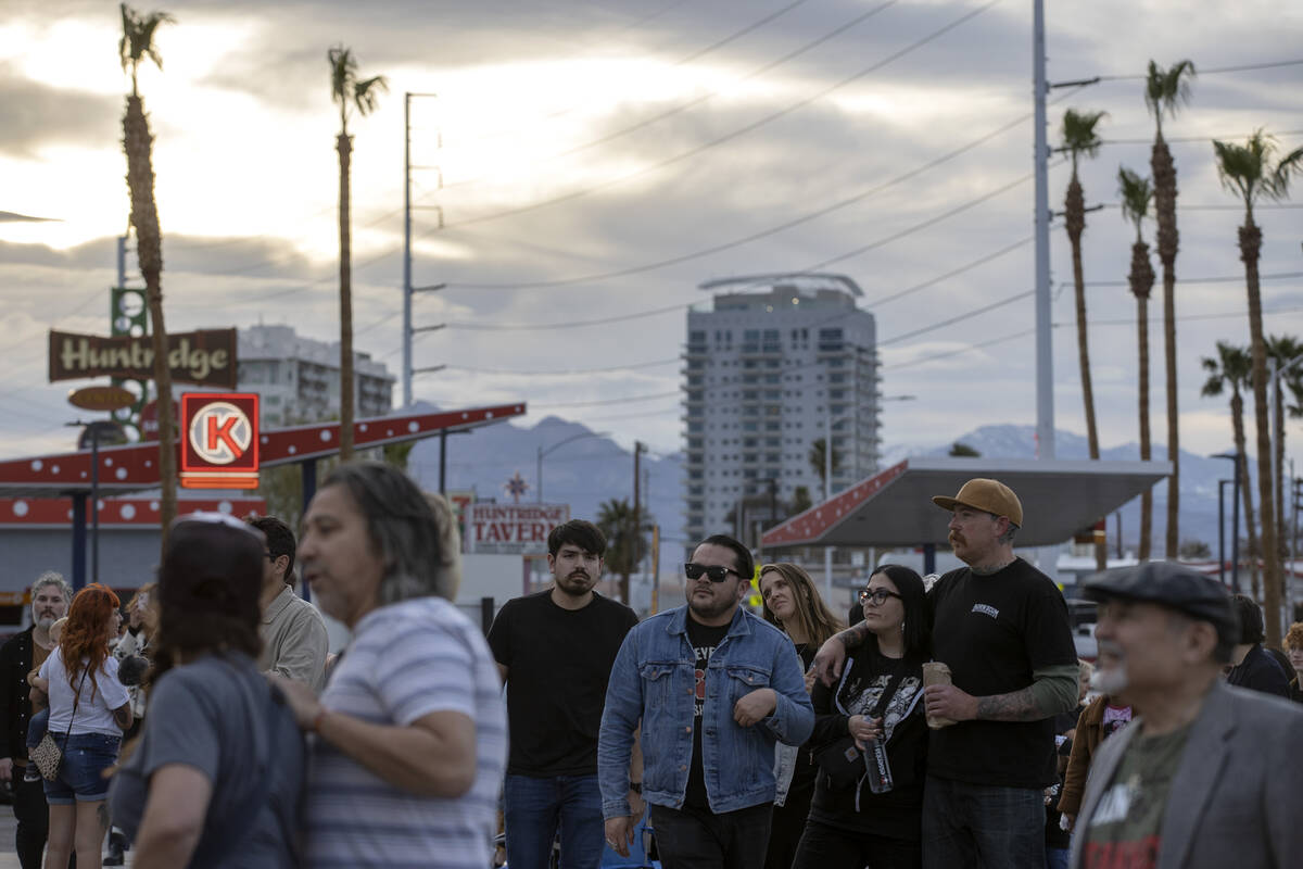 Attendees of an event to relight the marquee at the Huntridge Theater mingle on Friday, April 7 ...