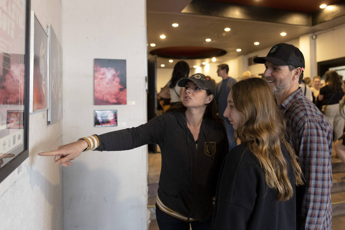 Allison Bonano, left, Isabella Bonanno and Robb Bonanno view the art on display inside the Hunt ...