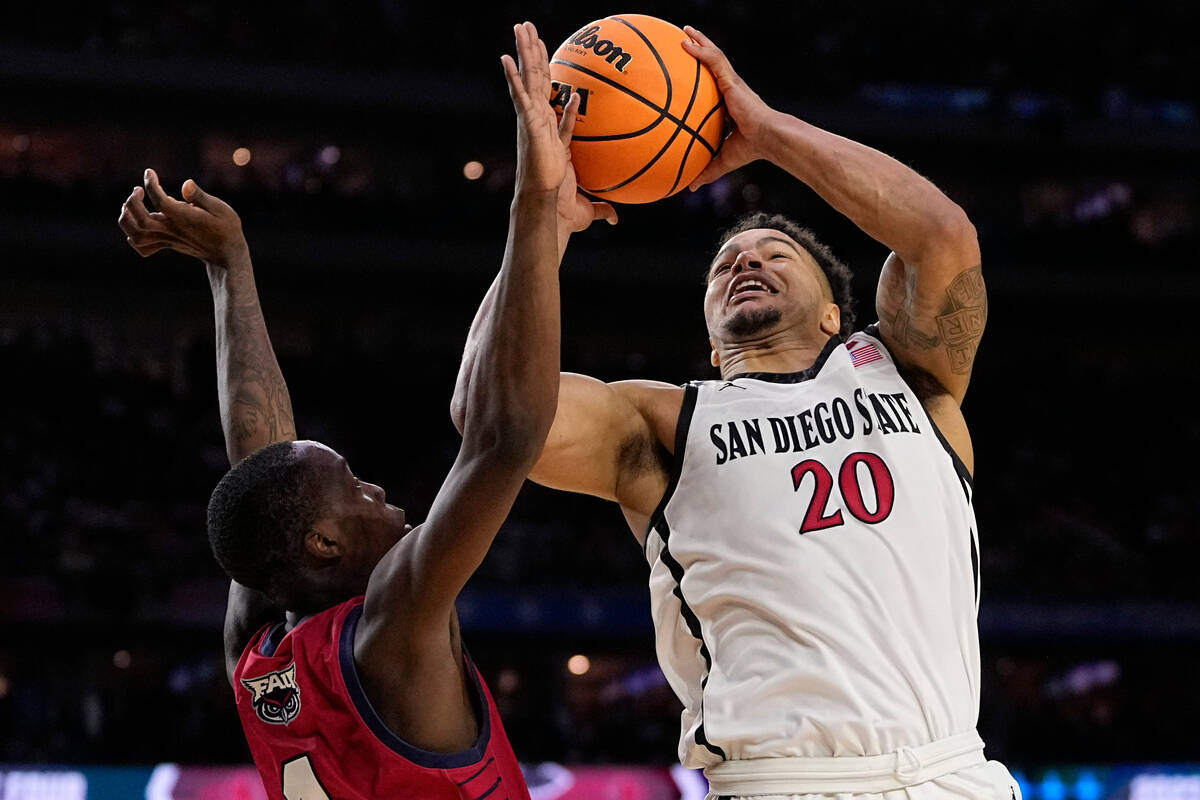 San Diego State guard Matt Bradley shoots over Florida Atlantic guard Johnell Davis during the ...