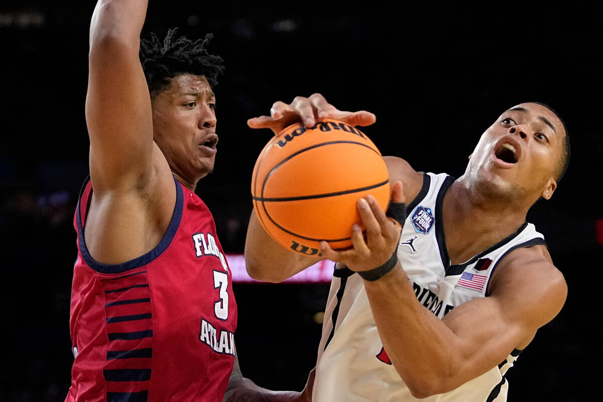 San Diego State forward Jaedon LeDee drives to the basket past Florida Atlantic forward Giancar ...