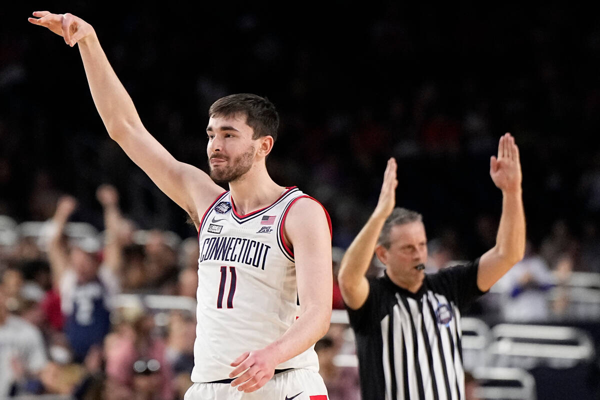 Connecticut forward Alex Karaban celebrates after scoring against Miami during the first half o ...