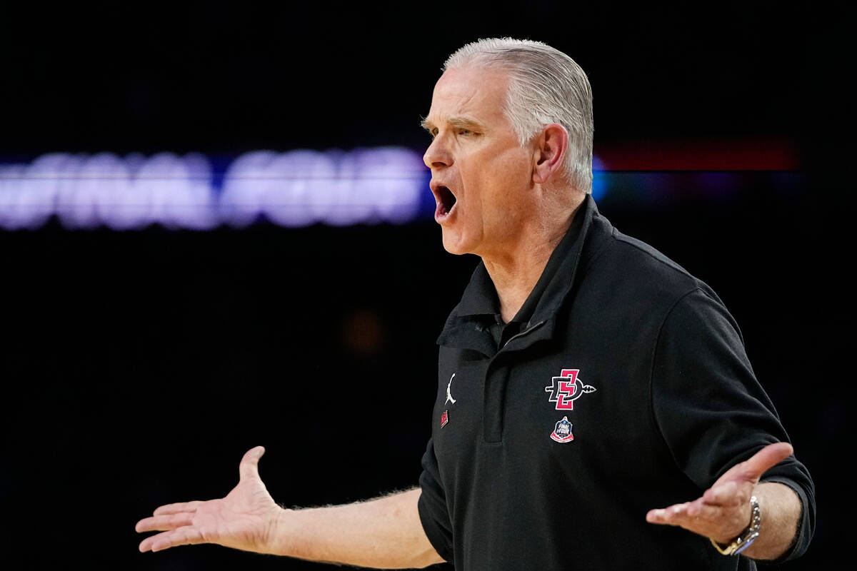 San Diego State head coach Brian Dutcher reacts during the first half of a Final Four college b ...