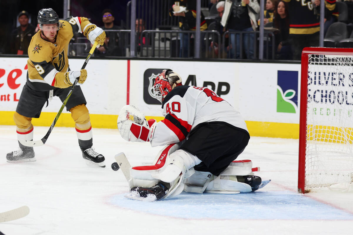 Vegas Golden Knights center Jack Eichel (9) shoots the puck for a score against New Jersey Devi ...