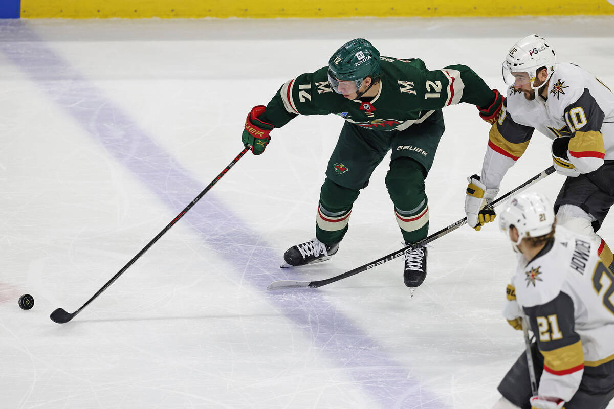 Minnesota Wild left wing Matt Boldy (12) goes after the puck against Vegas Golden Knights cente ...