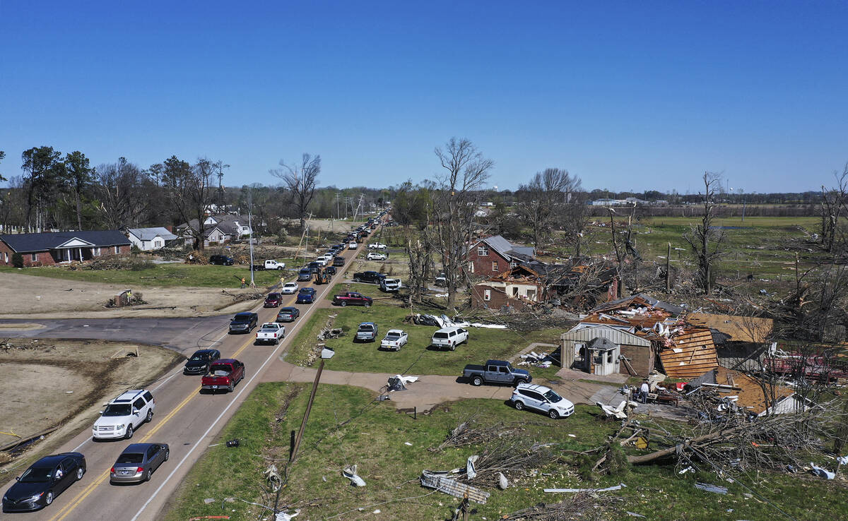 Traffic is backed up along one of the main thoroughfares in Covington, Tenn., Saturday, April 1 ...