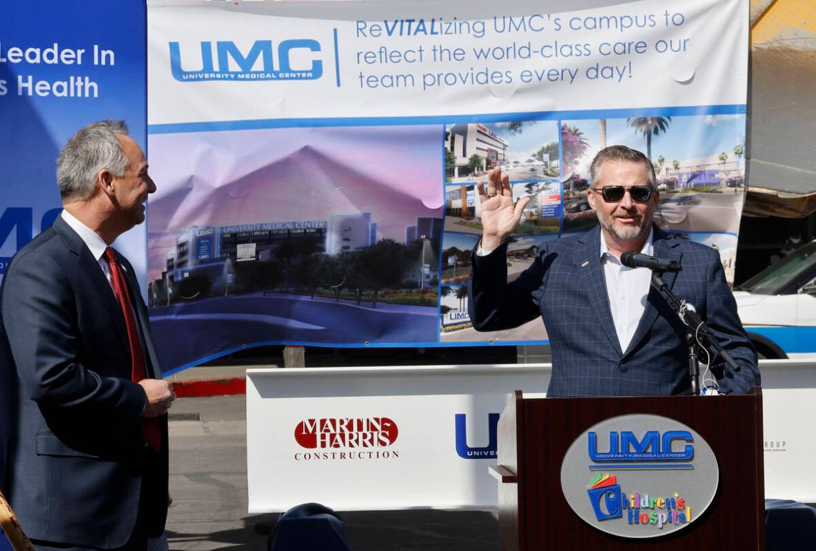 Guy Martin, president at Martin-Harris Construction, right, speaks as University Medical Center ...