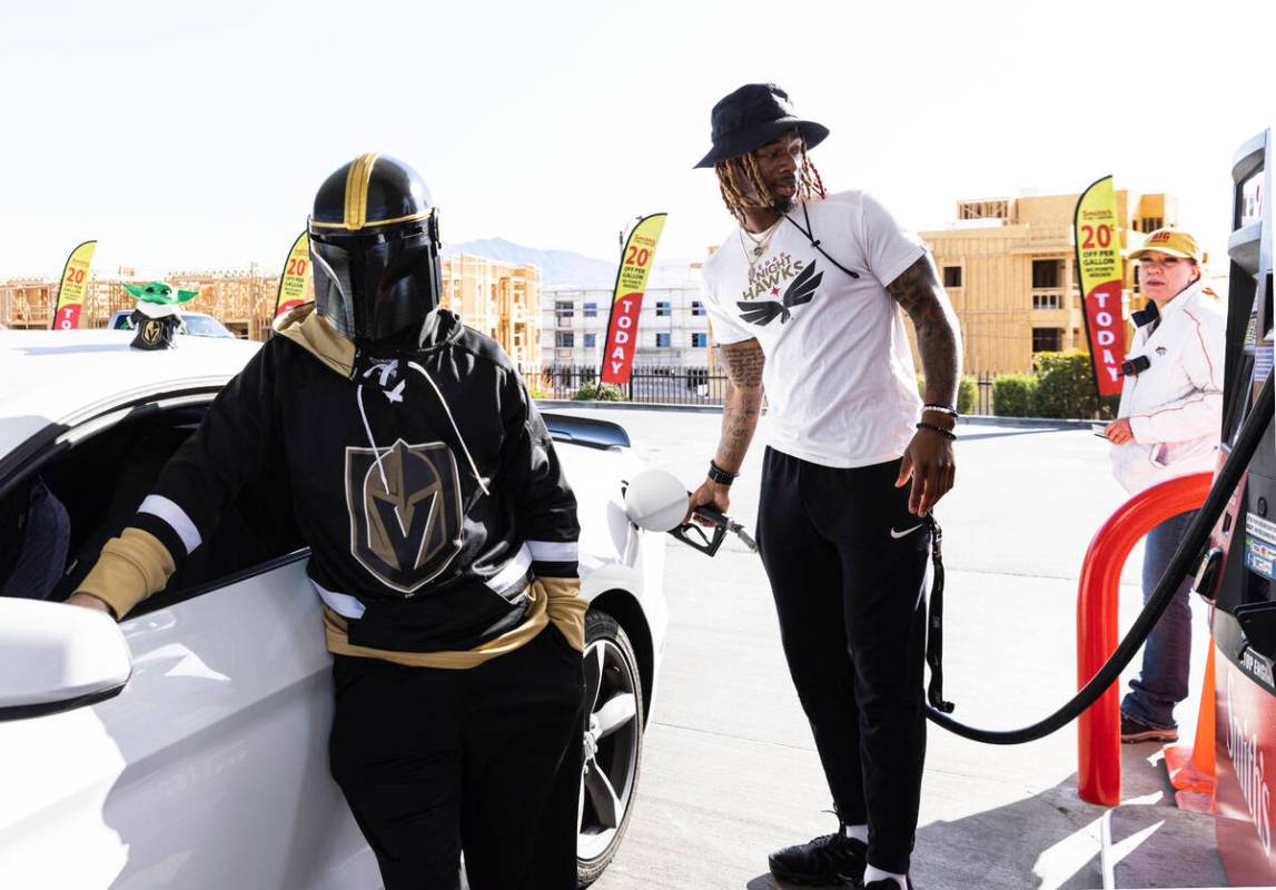 The Vegas Golden Night's fan Travis Bradley, left, shows his support for his team by wearing th ...