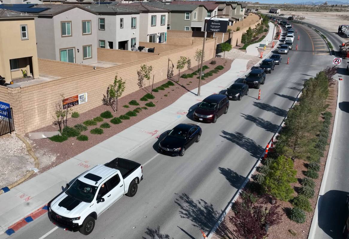 Cars line up to get free gas from Smith’s Marketplace on on Friday, April 14, 2023, in ...