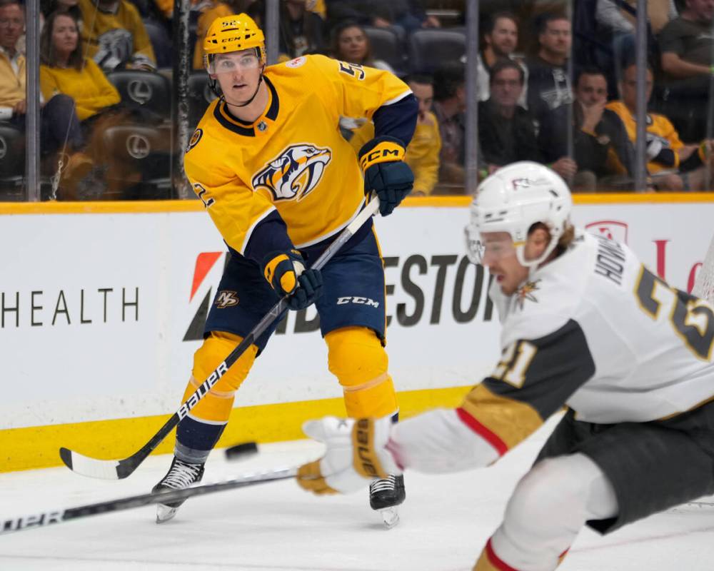 Nashville Predators defenseman Cal Foote (52) passes the puck past Vegas Golden Knights center ...