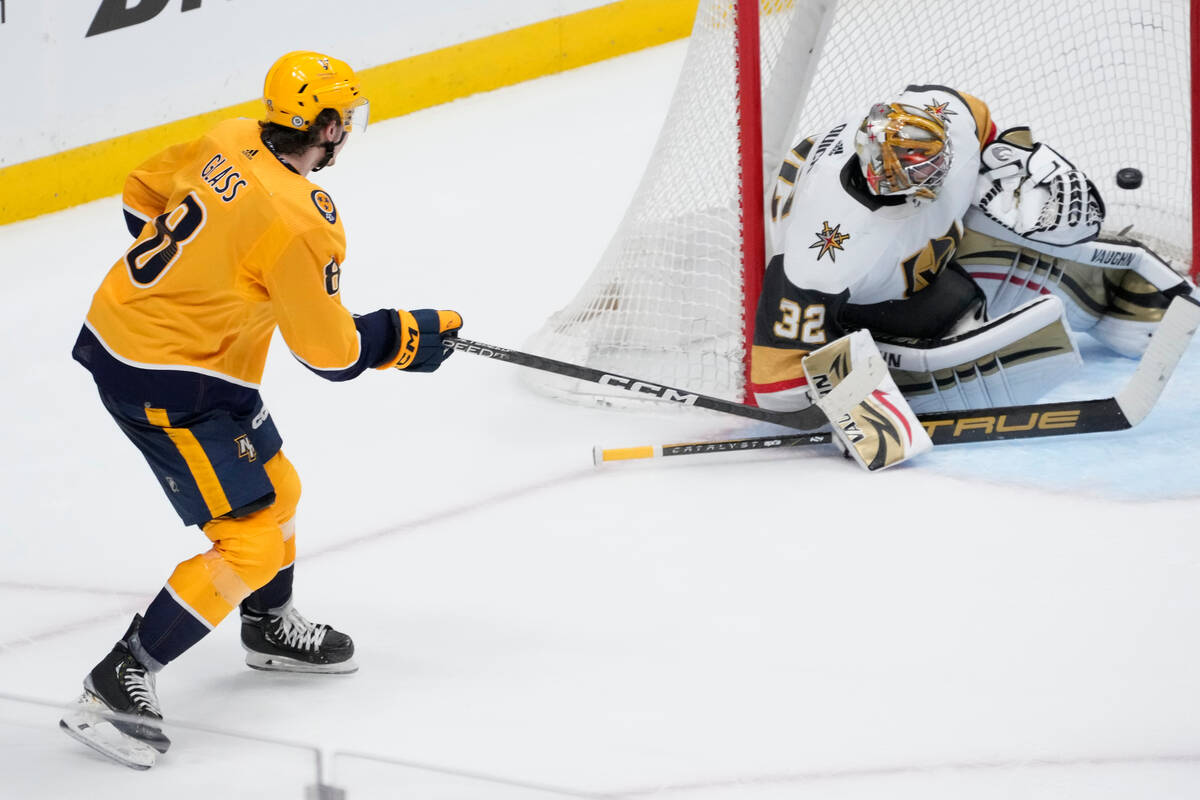 Nashville Predators center Cody Glass (8) scores past Vegas Golden Knights goaltender Jonathan ...