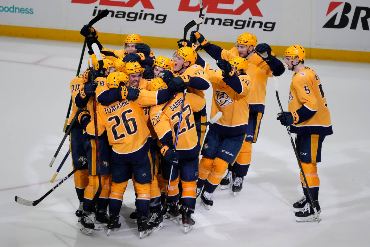 The Nashville Predators celebrate the team's 3-2 overtime win against the Vegas Golden Knights ...