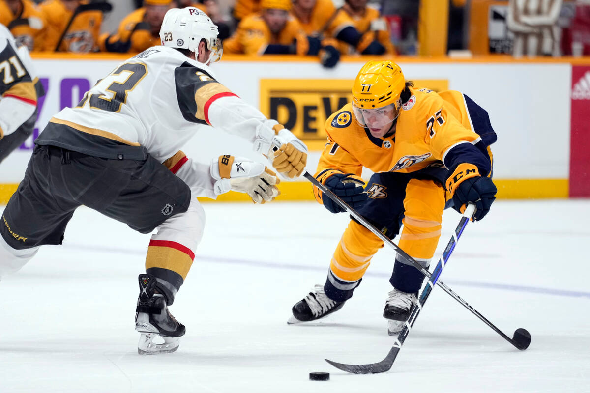 Nashville Predators right wing Luke Evangelista (77) moves the puck past Vegas Golden Knights d ...