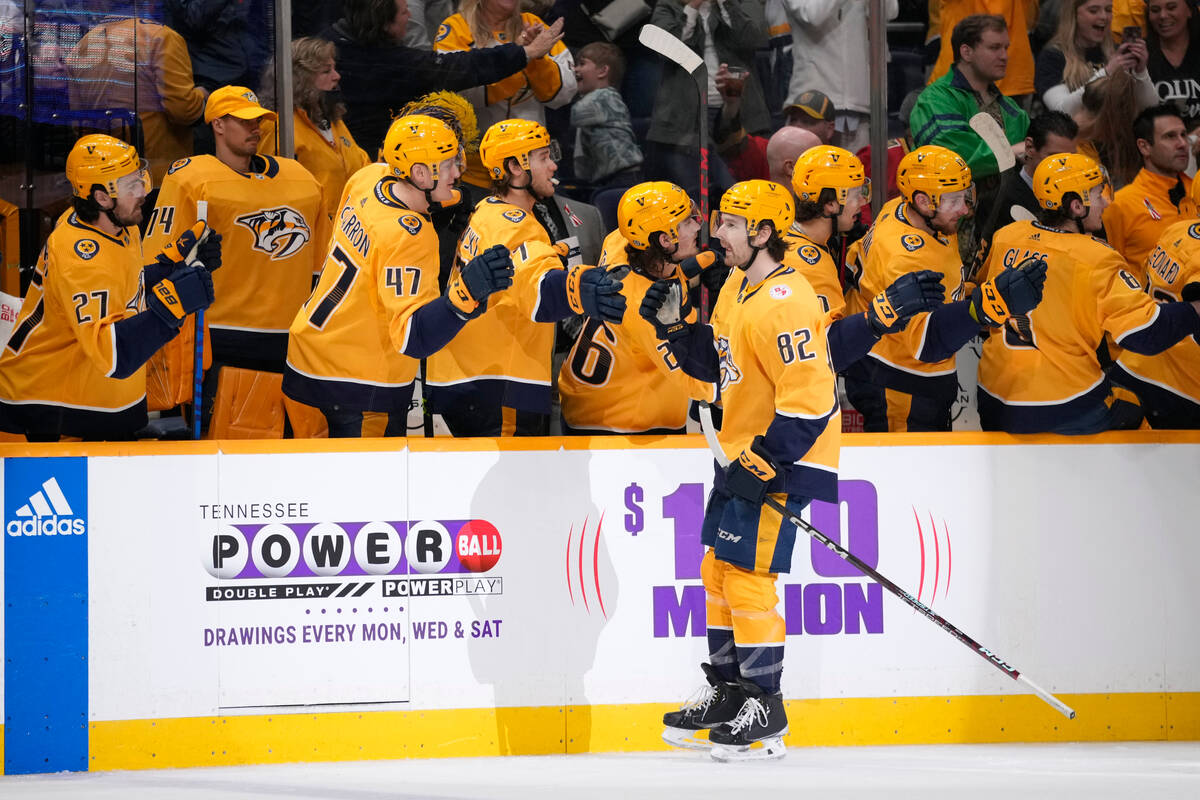 Nashville Predators center Tommy Novak (82) is congratulated after his goal against the Vegas G ...