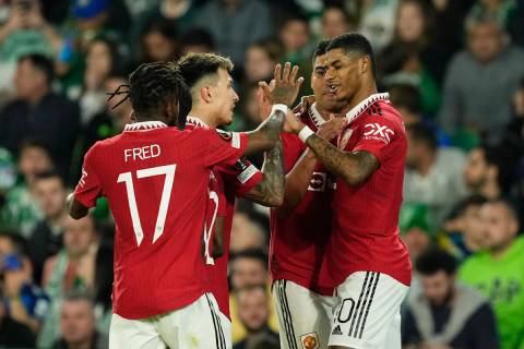 Manchester United's Marcus Rashford, right, celebrates after scoring his side's first goal duri ...