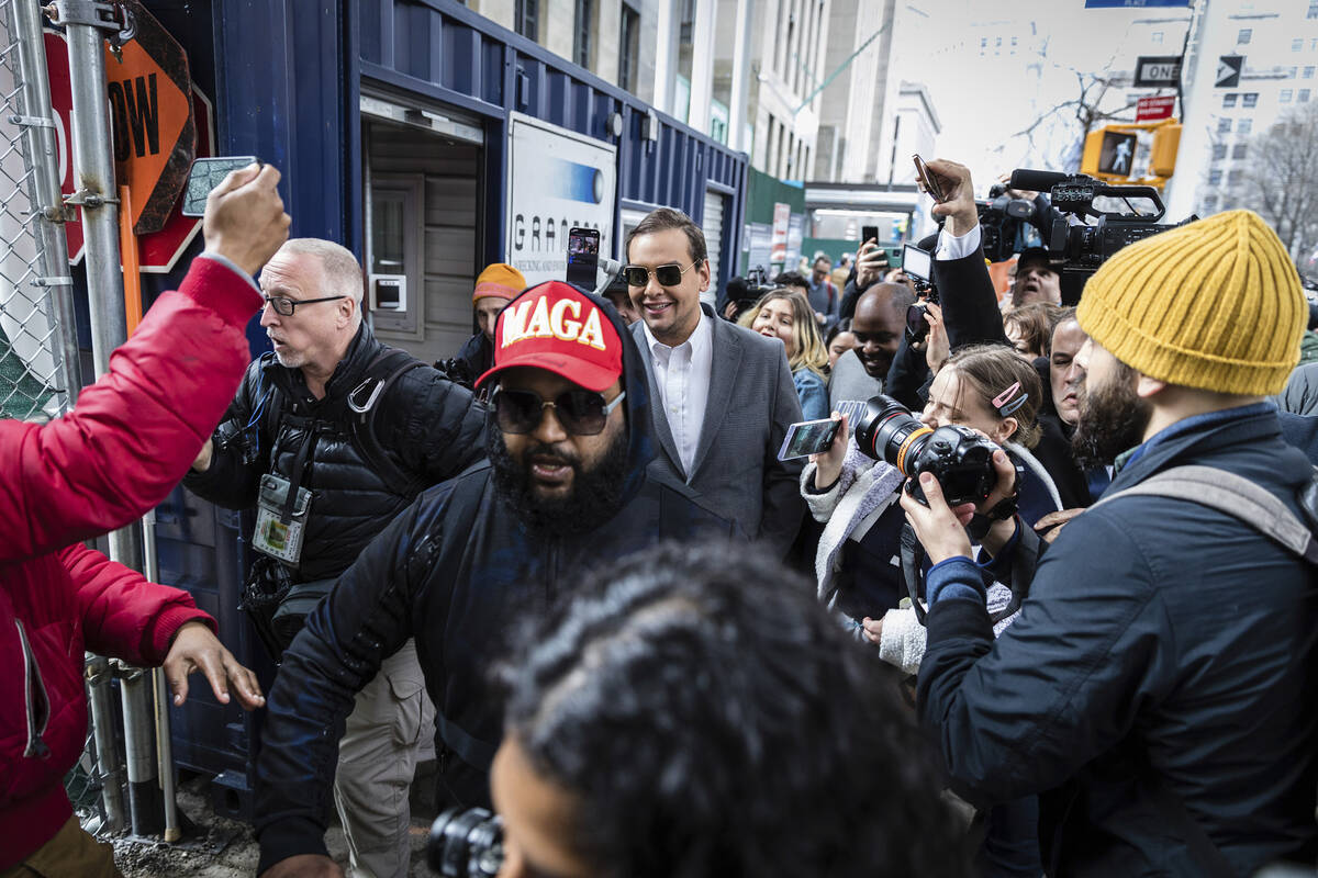 Rep. George Santos, R-N.Y., walks past the criminal courthouse in New York on Tuesday, April 4, ...