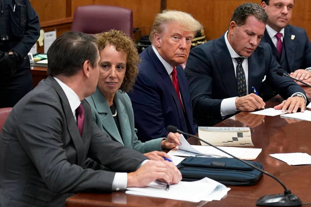 Former President Donald Trump sits at the defense table with his defense team in a Manhattan co ...